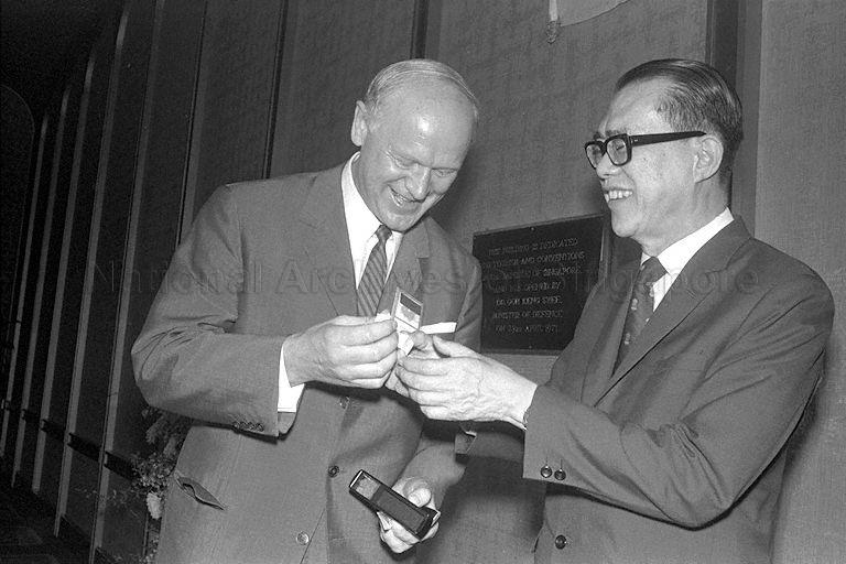 Minister for Finance Hon Sui Sen receiving a small Merlion ivory seal with his name carved in Chinese characters as gift from Chairman of Rollei Dr H Peesel during luncheon for journalists attending a week-long Rollei International Press Conference held at Shangri-La Hotel in Orange Grove Road, hosted by Singapore Press Club and Economic Development Board
