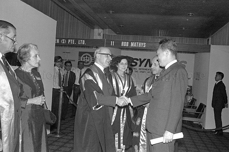 Prime Minister Lee Kuan Yew being congratulated by President of the Royal Australasian College of Surgeons Dr John Loewenthal after receiving the Honorary Fellowship of the Royal Australasian College of Surgeons at opening of the College's 46th General Scientific Meeting at Shangri-La Hotel