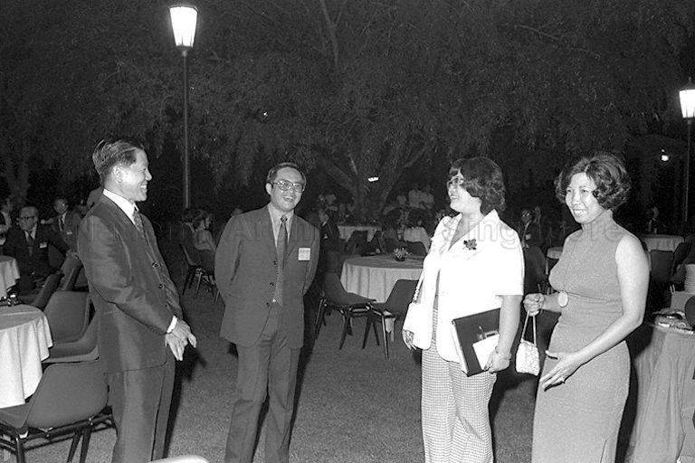 Minister for Culture Jek Yeun Thong (left) and Mrs Jek (right) talking to guest and Hong Kong star Lydia Sum Tinha, better known as Fei Fei, at the Istana garden party.
