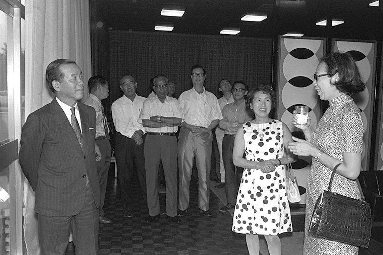 Japanese Ambassador Tokichiro Uomoto (left) and his wife (second from right) chatting with Mrs Lee Kuan Yew (right), who returned from an eight-day unofficial visit to Japan with the Prime Minister, at the VIP lounge in Singapore Paya Lebar airport.