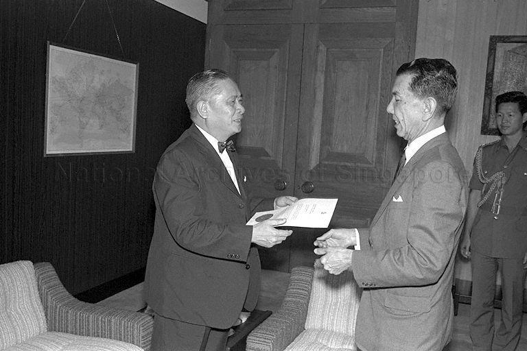 Singapore's ambassador to Japan, Wee Mon Cheng, receiving his Letter of Credence from President Dr Benjamin Sheares (right) in the Istana