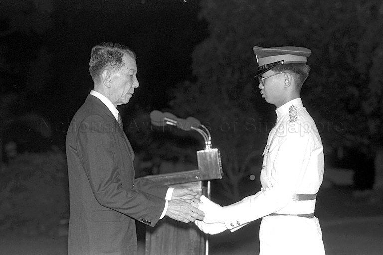 President Dr Benjamin Henry Sheares presenting award to President's Scholar Lim Teik Hock from St Andrew's Secondary School at ceremony held at Istana