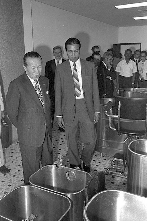 Cinema magnate Runme Shaw (left) touring the Runme Shaw Centre for Sports Medicine and Research at the Sports Medicine Unit of the National Stadium after its opening ceremony