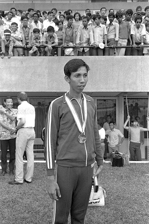 Singapore's high jumper Nor Ashar Hamid with his gold medal at Seventh Southeast Asian Peninsular (SEAP) Games at National Stadium, Singapore. He was acclaimed the best in Asia with a record-shattering 2.12 metres.