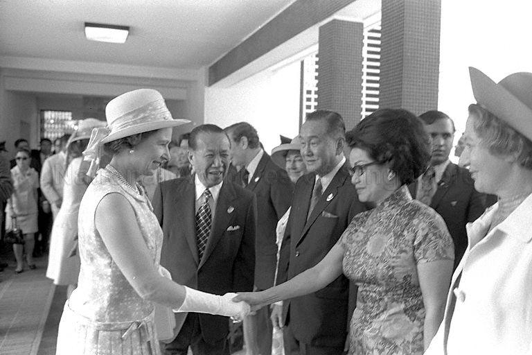 Chairman of Singapore Turf Club Tan Sri Runme Shaw presenting the club's committee members to Queen Elizabeth II when she arrives at the race course in Bukit Timah. The lady shaking hands with the Queen was Judy Lee's mother Elsie TEO Yan Lin, wife of TEO Cheng Hay - Committee member.