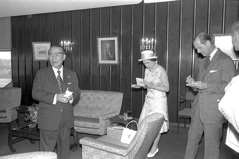Queen Elizabeth II, Duke of Edinburgh Prince Philip and Chairman of Singapore Turf Club Tan Sri Runme Shaw at the club before lunch is served