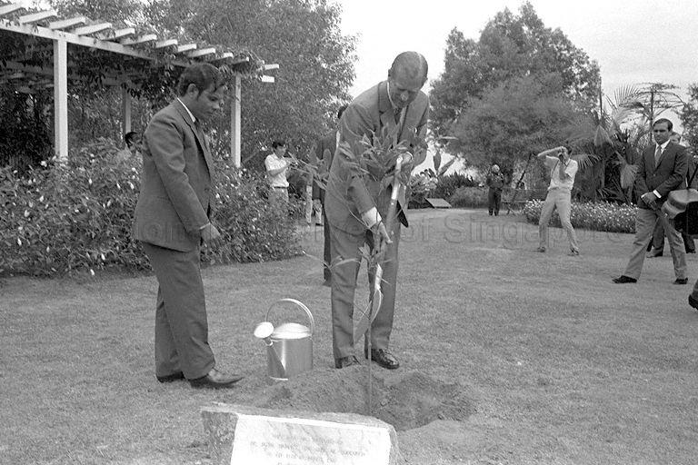 Duke of Edinburgh Prince Philip planting a tembusu tree at Jurong Hill during his and Queen Elizabeth II's visit to Jurong