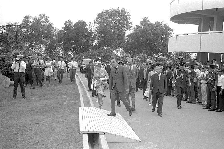 Queen Elizabeth II and Duke of Edinburgh Prince Philip, accompanied by Chairman of Jurong Town Corporation (JTC) Woon Wah Siang, proceeding to Garden of Fame at Jurong Hill Park to plant a tembusu