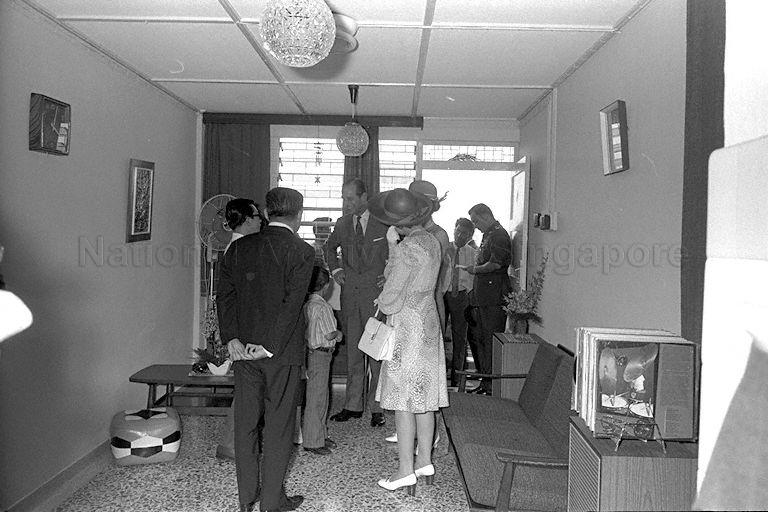 Queen Elizabeth II, Duke of Edinburgh Prince Philip and Princess Anne visiting the three-room flat of teacher Lim Cheng Kee on the 18th floor of Block 53, Toa Payoh Lorong 5