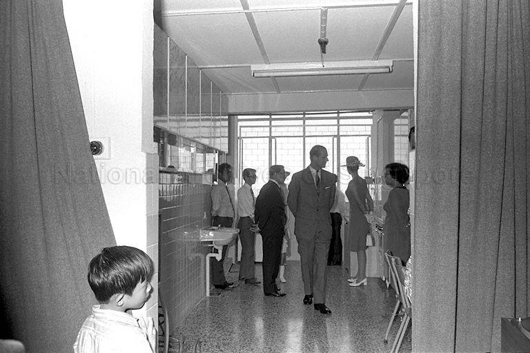 Queen Elizabeth II, Duke of Edinburgh Prince Philip and Princess Anne visiting the three-room flat of teacher Lim Cheng Kee on the 18th floor of Block 53, Toa Payoh Lorong 5