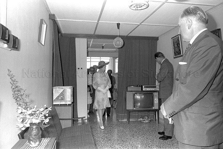 Queen Elizabeth II and Duke of Edinburgh Prince Philip visiting the three-room flat of teacher Lim Cheng Kee on the 18th floor of Block 53, Toa Payoh Lorong 5