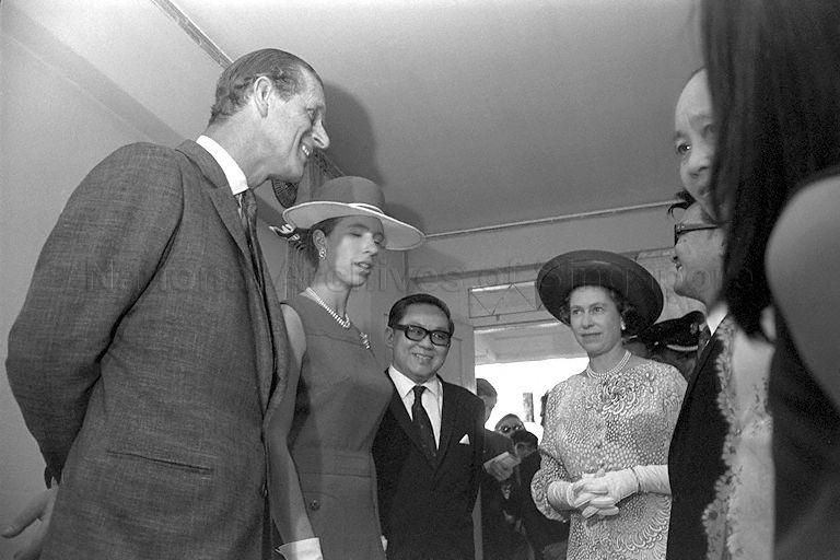 Queen Elizabeth II, Duke of Edinburgh Prince Philip and Princess Anne, accompanied by Chairman of Housing and Development Board (HDB) Lee Hee Seng (third from left), visiting the two-room flat of Thomas Pang on the first floor of Block 54, Toa Payoh Lorong 5