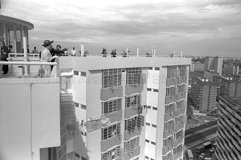 Queen Elizabeth II looking out from the viewing gallery on the rooftop of Block 53, Toa Payoh Lorong 5, during her visit to the housing estate<br />