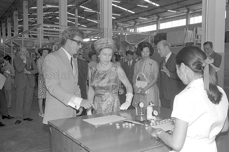 Queen Elizabeth II touring Crown Cork factory in Jurong industrial estate during her three-day state visit to Singapore