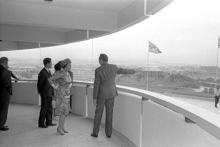 Queen Elizabeth II, accompanied by Chairman of Jurong Town Corporation (JTC) Woon Wah Siang (right) and Minister for Culture Jek Yeun Thong (second from left), at Jurong Hill Tower. The Queen was on a three-day state visit to Singapore.