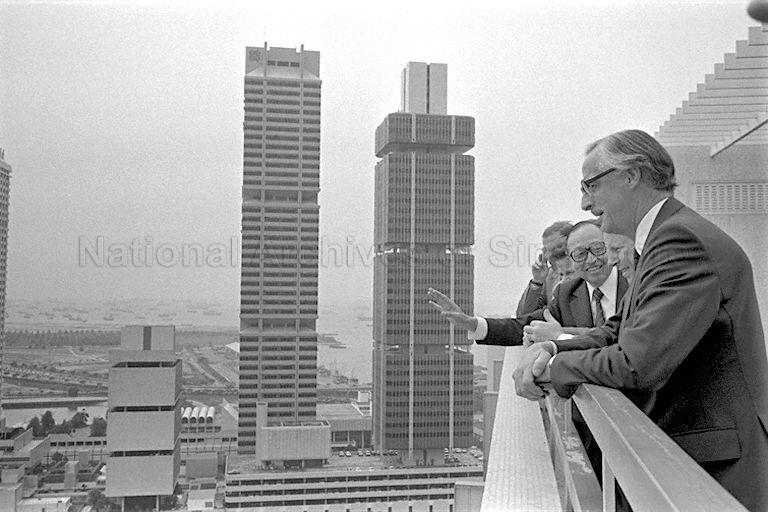 Minister for National Development Teh Cheang Wan (hands outstretched) showing the view from the top of Ministry of National Development Building to visiting Lord Mayor of London Sir Christopher Leaver (second from right) and delegation