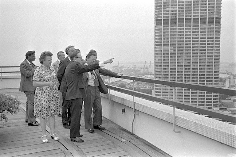 Minister for National Development Teh Cheang Wan (centre) showing the view from the top of Ministry of National Development Building to visiting Lord Mayor of London Sir Christopher Leaver (right) and delegation