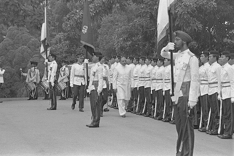 President Zia ul-Haq of Pakistan, who arrives in Singapore for a three-day state visit, inspecting guard of honour during welcome ceremony at Istana
