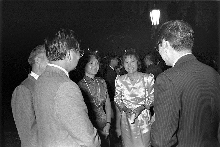 President Scholar Goh Li Meng (second from right) and parents chatting with guests at reception following the President's Scholarship awards presentation at Istana.