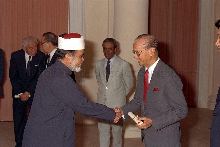 Isa Syed Mufti of Singapore Haji Syed Isa Semait receiving Instrument