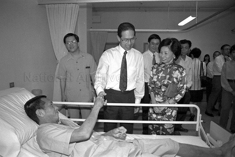 President Ong Teng Cheong and First Lady Mrs Ong Siew May pause to speak with a patient during a tour at the Ren Ci hospital at Buangkok Green