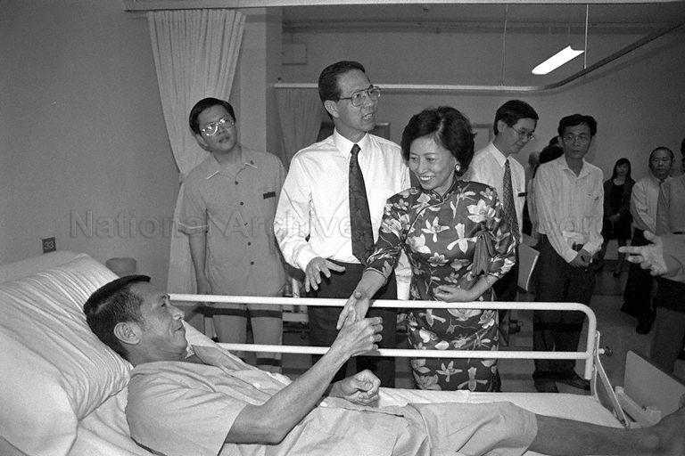 President Ong Teng Cheong and First Lady Mrs Ong Siew May pause to speak with a patient during a tour at the Ren Ci hospital at Buangkok Green