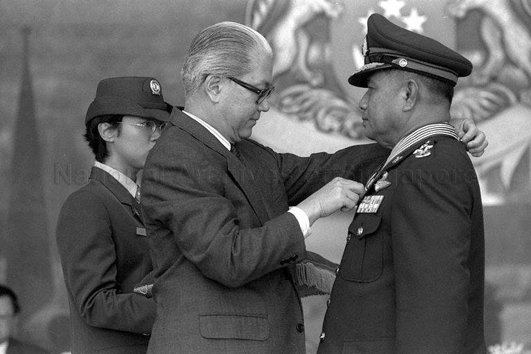 Deputy Prime Minister and Minister for Defence Dr Tony Tan Keng Yam conferring Meritorious Service Medal (Military) to Commander-in-Chief of Royal Thai Army General Pramon Phalasin (right) during investiture ceremony at MINDEF, Gombak Drive