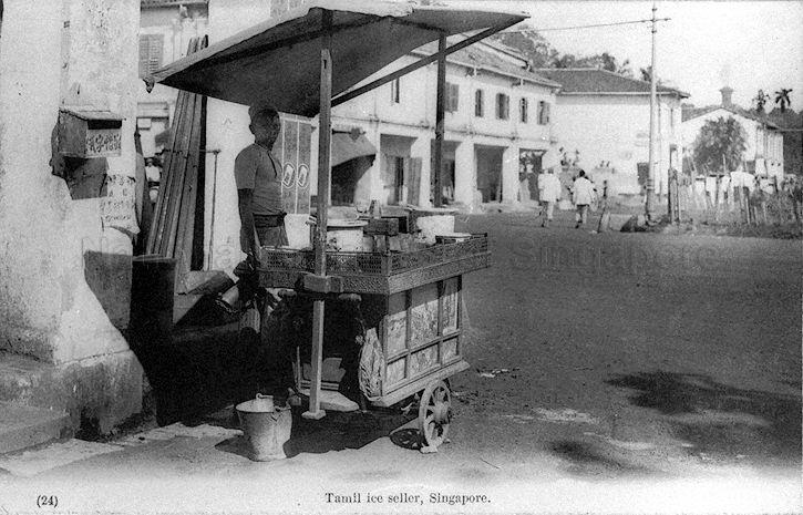 An ice seller at his cart by the roadside in Singapore