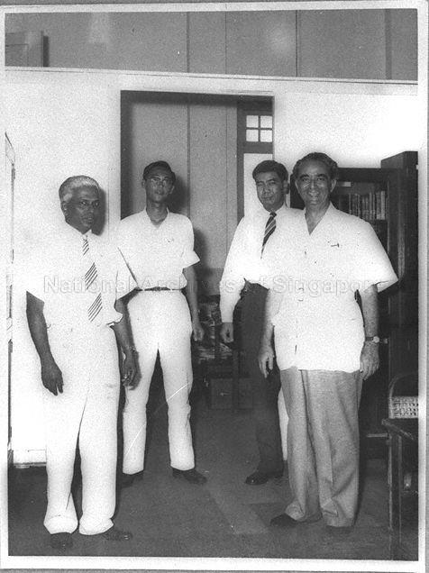 Principal of Raffles Institution (RI) V Ambiavagar (left) posing for photograph with (from second left) RI student, Goh Chok Tong (who later became Prime Minister of Singapore from 1990 to 2004), RI teacher and President of Singapore Youth Council (1959) Seah Yun Khong and the first Chief Minister of Singapore (1955-1956) David Marshall
