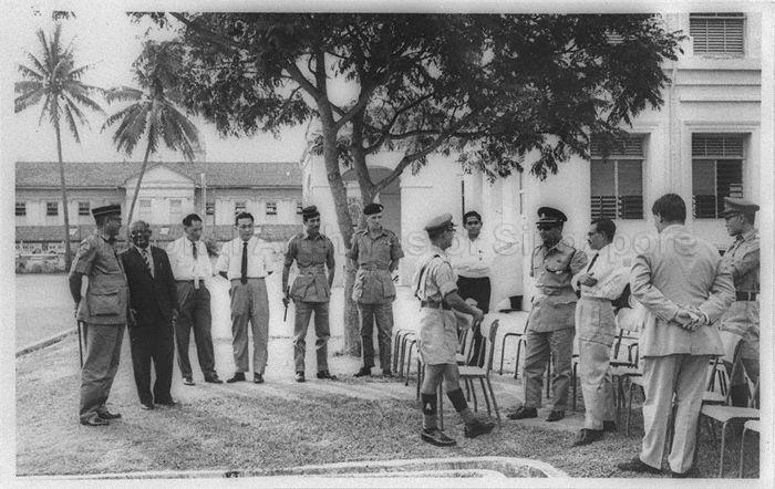 Principal of Raffles Institution (RI) E W Jesudason (second from left) with guests at RI Cadet Corps annual inspection. On the left is Chief Inspector Colonel Raymond James Minjoot.