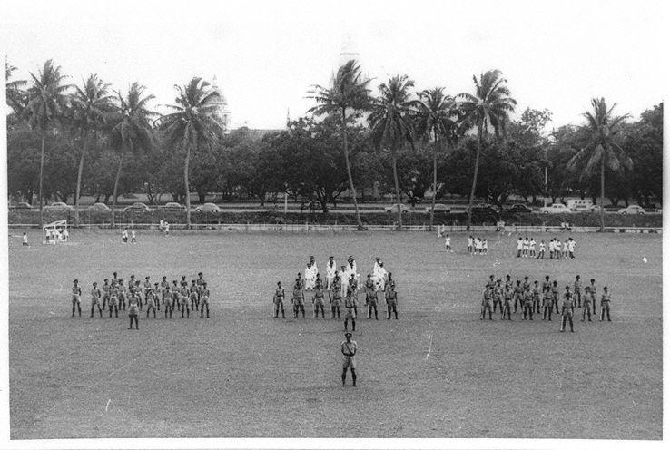 Raffles Institution - Uniform groups assembled on school field, ready for inspection