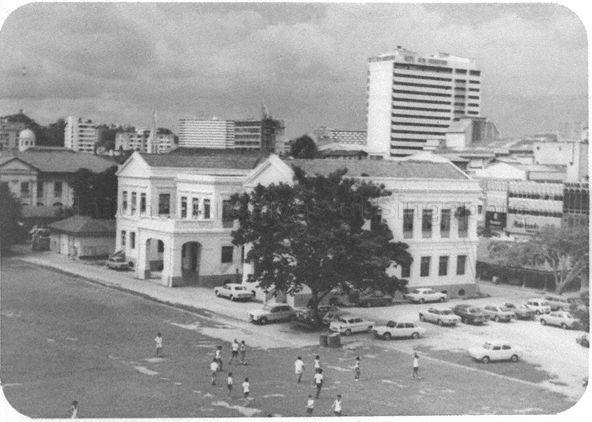 Raffles Institution's Annex E building, housing the Science Block and former Raffles Girls' School (RGS), at Bras Basah Road. At the time when this photograph was taken, RGS had been separated into primary and secondary sections with the primary section at Queen Street and the secondary at Anderson Road.
