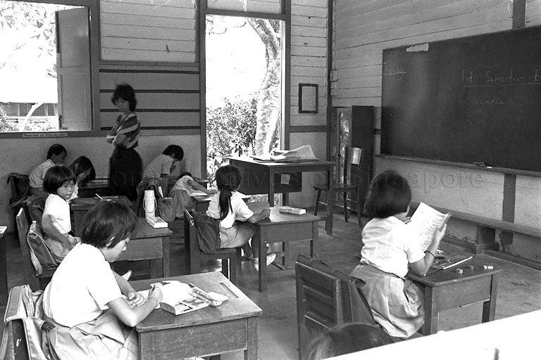 Neo Tiew Village (Lim Chu Kang) -- View of students of Kay Wah Primary School (branch of main school at Ama Kheng) sitting for the First Semestral Examination in classroom