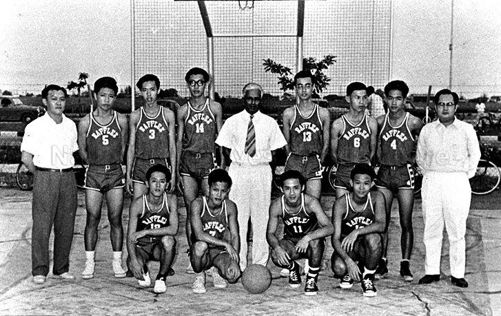 Group photograph of Raffles Institution basketball team. Standing in the centre is Principal V Ambiavagar.