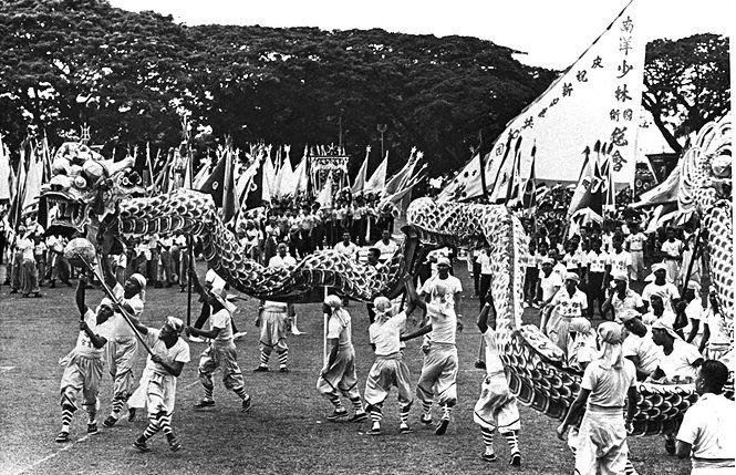 Dragon dance performance at Singapore's first National Day Parade held at the Padang