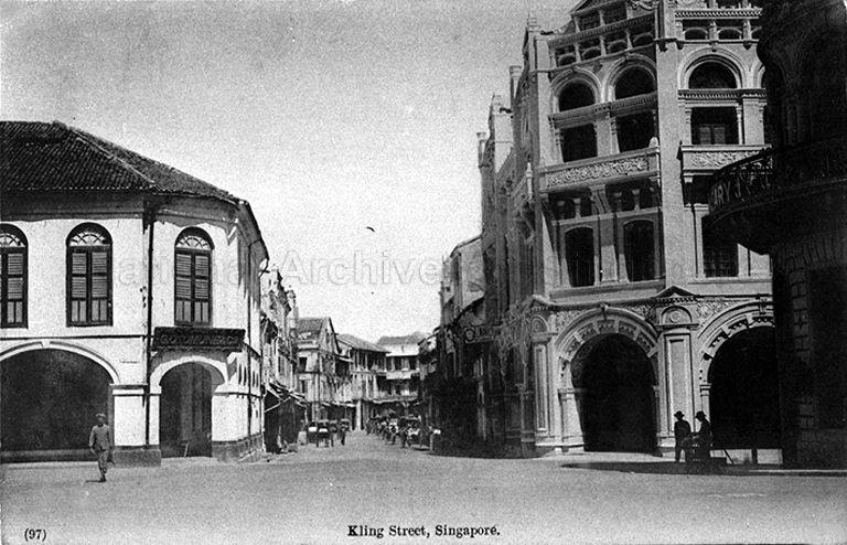 View of northwest corner of Raffles Place, formerly known as Commercial Square, at junction of Kling Street (later known as Chulia Street) and Bonham Street. The ornate building on the right is Bonham Building and on the extreme right is the Dispensary building.
