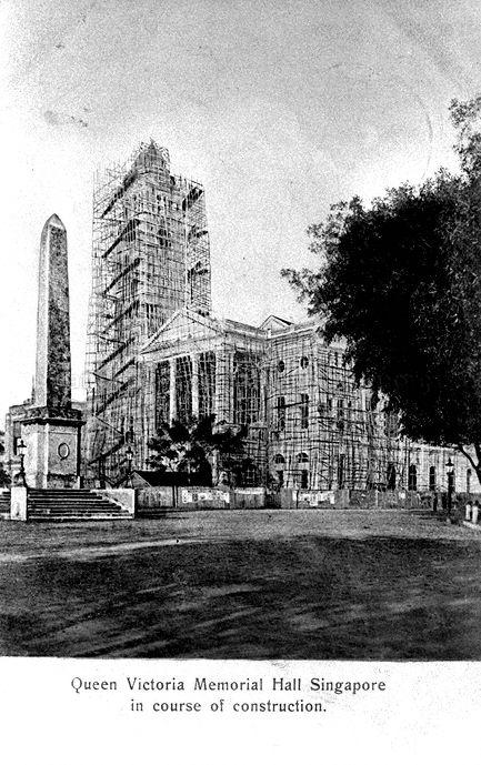Victoria Memorial Hall and clock tower under construction. The Dalhousie Obelisk (left) was moved to a new site at the northern approach to Anderson Bridge in 1910 and then to its current site at Empress Place in 1911, after opening of the Bridge.