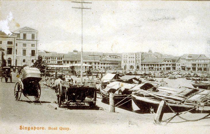 Boat Quay with part of the Colonial Secretariat offices visible on the left. Across the Singapore River is the Bonham Building (centre), housing Katz Brothers Limited. It was demolished in 1970 to make way for the 30-storey United Overseas Bank.