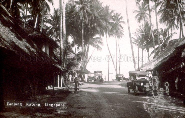 Corner where end of Upper East Coast Road meets beginning of Bedok Road (perpendicular to foreground). The whole stretch of coast from here towards Tanjong Rhu was known as Tanjong Katong at that time. The rear-doored "mosquito bus" in the centre of this postcard was the only means of public transport to the area.
