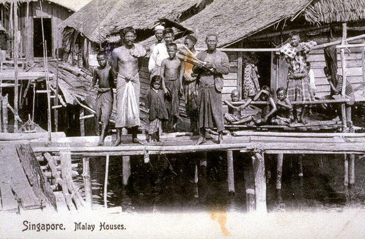 Orang Laut (native Malays) of Pulau Brani in front of their houses on stilts, Singapore