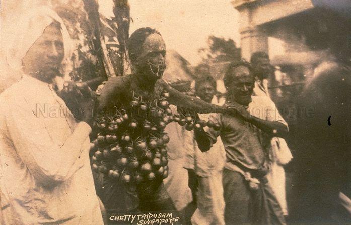 A Hindu devotee with body piercings hung on his body during the Thaipusam festival procession in Singapore