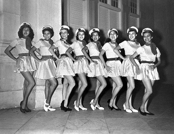 Members of Singapore Girls' Sports Club tap dance group posing for a picture in their costumes. Their dance entitled "Anchors Aweigh" was part of a four-night performance of "Show Business 1954" at Victoria Theatre, organised in aid of the club's building fund.