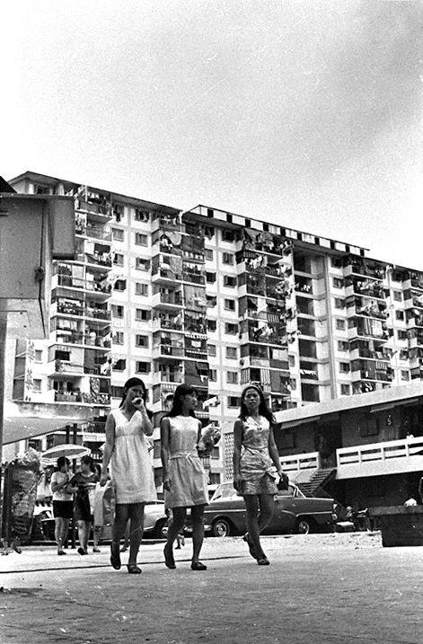 View of Housing and Development Board (HDB) flats with laundry hanging out of the balconies in MacPherson housing estate. These public housing apartments were some of the first-generation flats built by HDB in the 1960s.
