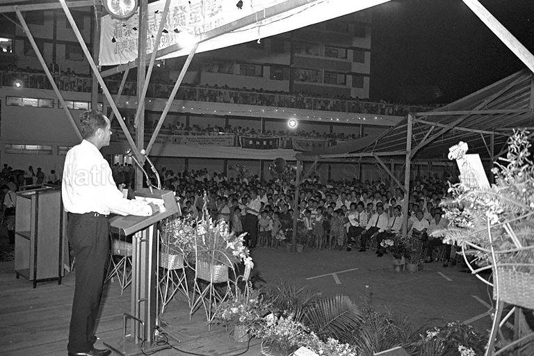 Minister for Law and National Development E W Barker speaking during official opening of hawker stalls at Block 50, Havelock Road, Bukit Ho Swee Estate.