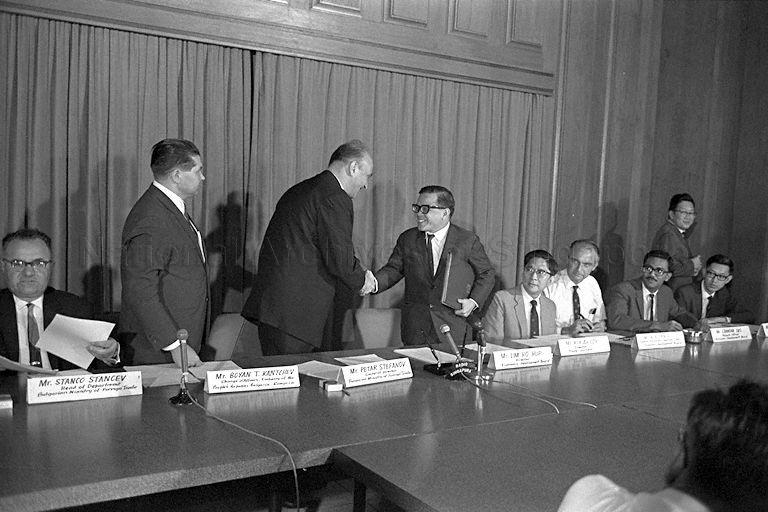 General Director of Bulgaria's Ministry of Foreign Trade Petar Stefanov (leader of the Bulgarian trade mission) and Director of Economic Development Board Lim Ho Hup exchanging handshakes after signing the trade agreement between Bulgaria and Singapore at Economic Development Board.