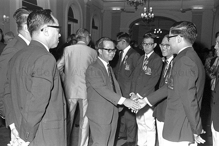 Deputy Prime Minister Dr Toh Chin Chye congratulating Koh Cher Siang, one of the President's Scholars during award presentation ceremony at Istana