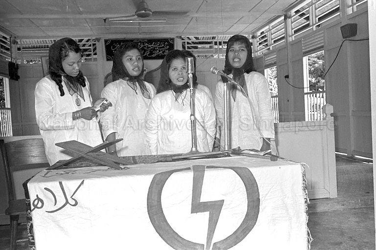 A group of ladies performing Islamic vocal music during Prophet Mohammed's birthday celebration held at Kampong Tengah.