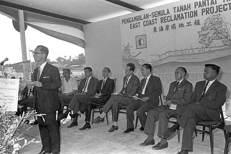 Minister for Law and National Development E W Barker (seated fourth from right) attending inauguration of East Coast reclamation project.