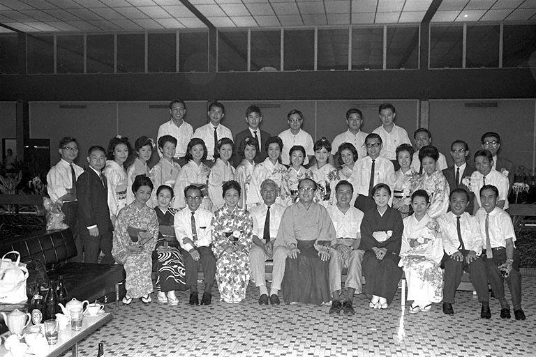 Group photograph of Japanese cultural dance troupe from Hanayagi Dance School of Tokyo and Shochiku Dance School with officials at Paya Lebar Airport before their departure via Lufthansa flight 759