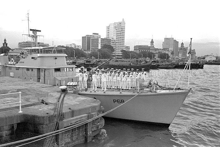 Men from the Singapore Naval Volunteer Force standing proudly at attention on RSS Panglima. They witnessed the first raising of the new white-and-red naval ensign that bore the nationâ€™s crescent moon and five stars and an eight-pointed marinerâ€™s star.